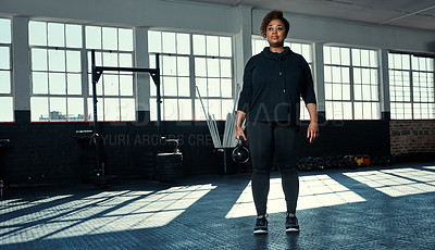 Buy stock photo Fitness, weightlifting or black woman in gym with kettlebell, power or cross training in bodybuilding. Exercise, space or athlete with equipment, joint workout or strength in muscle transformation.
