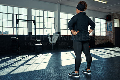 Buy stock photo Thinking, gym and back of woman ready for exercise, workout and training in sports center. Athlete, space and person with thoughtful, reflection and wondering for wellness, health and fitness