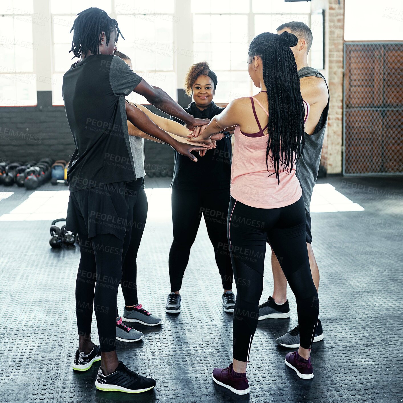 Buy stock photo Woman, group and pile hands at gym for fitness goals, motivation and portrait at training center. People, friends and circle for support in class, celebration or wellness achievement at exercise club