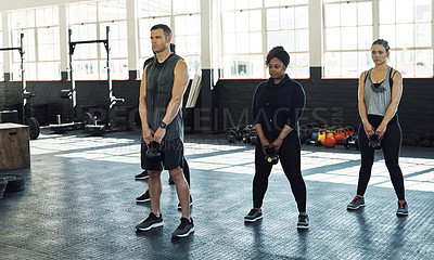 Buy stock photo Training, kettlebell and people in gym, fitness and support for body development. Group, men and women in wellness center, exercise or equipment for health benefits, challenge or routine for strength