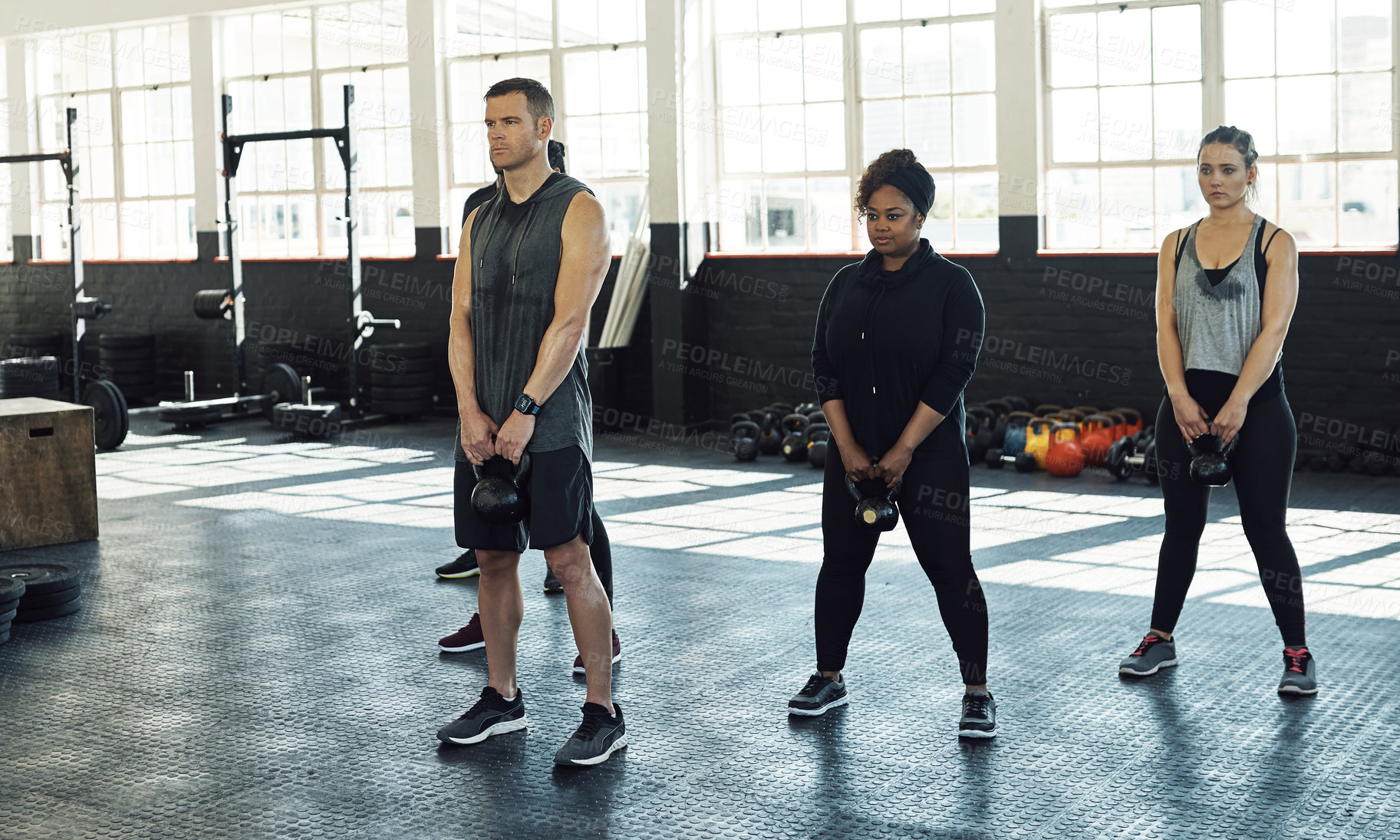 Buy stock photo Training, kettlebell and people in gym, fitness and support for body development. Group, men and women in wellness center, exercise or equipment for health benefits, challenge or routine for strength
