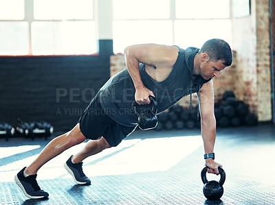 Buy stock photo Man, push up and kettlebell for muscle at gym with fitness, balance or power on floor for workout. Person, bodybuilder and exercise equipment for challenge, strong and training with weights at club