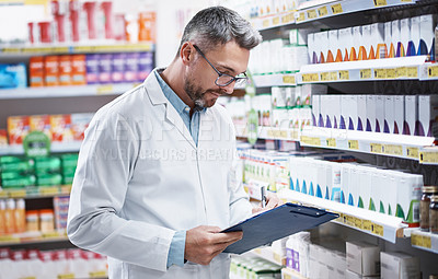 Buy stock photo Chemist, man and writing in pharmacy with clipboard, quality assurance and inspection for medicine. Mature person, pharmacist and checklist in drugstore with medical notes, inventory and healthcare.
