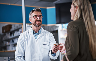 Buy stock photo Man, woman and pharmacy with credit card for payment, pills and advice for healthcare products at shop. People, discussion and customer experience with supplements, discount or sale at drug store