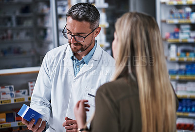 Buy stock photo Mature man, pharmacist and consulting customer with medication for pharmacy recommendation. Male person, chemist or helping woman with box for medical advice or prescription in drug dispensary store