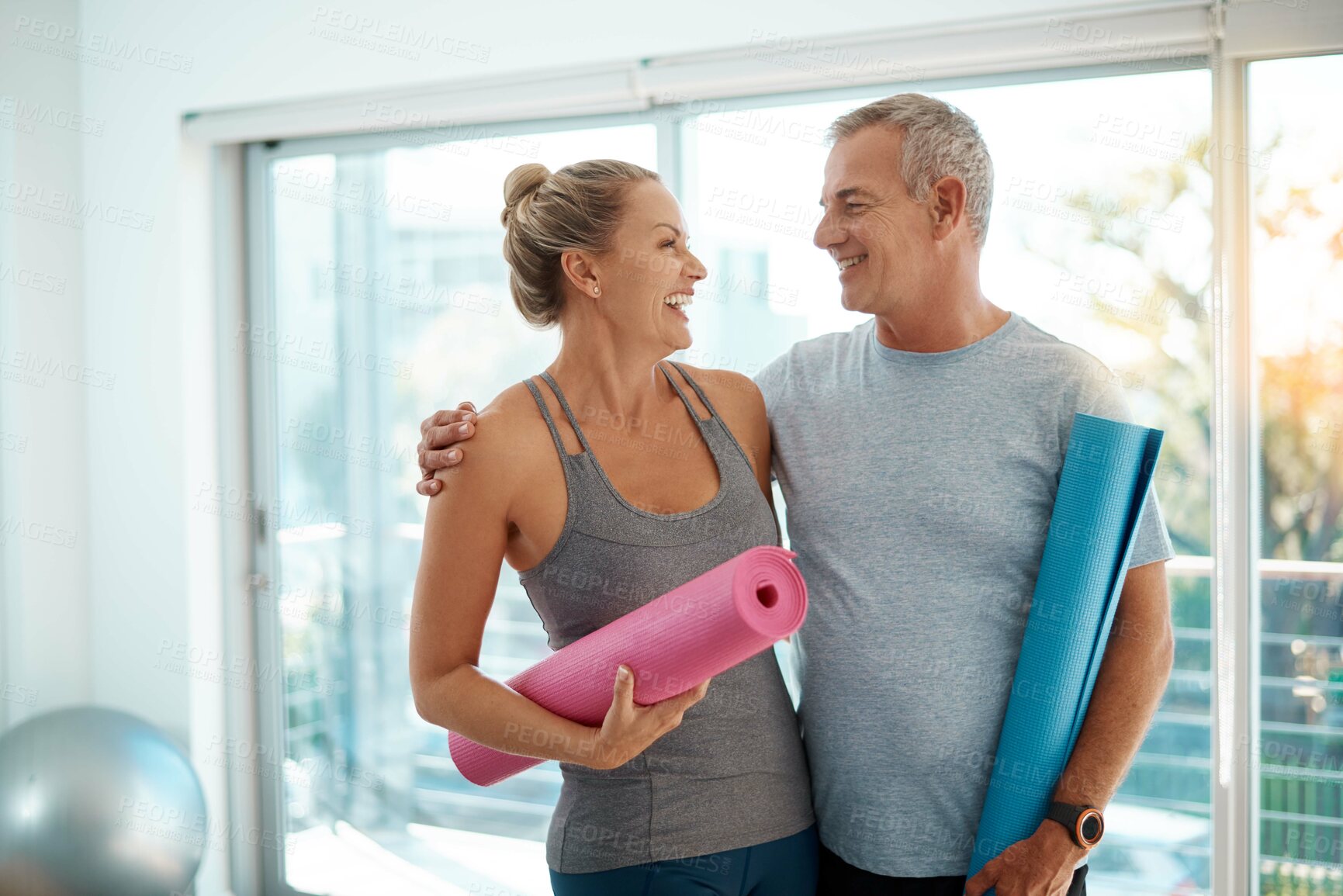 Buy stock photo Love, couple and laughing with yoga mat in studio to start fitness, support and ready for exercise. Active relationship, happy mature people and equipment at wellness club for health routine or funny
