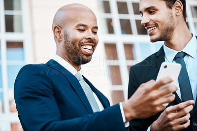 Buy stock photo Businessmen, friends and phone with smile for social media, accounting and funny joke in city. Low angle, financial advisor and tech for online video, research or app for networking in urban town