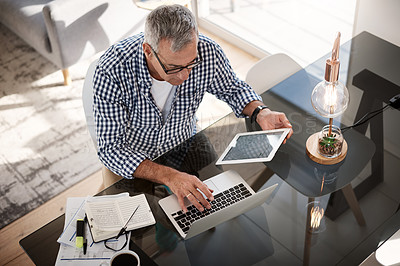 Buy stock photo Tablet, laptop or mature man with remote work in home for finance report, budget comparison or above. Freelancer, financial manager and tech for risk assessment, investment insight and market trends