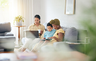 Buy stock photo Relax kid, tablet and family home, mother and gay people search social network, studying elearning and student ebook. LGBTQ, streaming education video and queer woman teaching child on lounge sofa