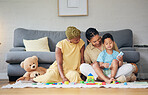 Playing, gay family and child with toys on a home floor for development, education and learning. Adoption, lesbian or LGBT women or parents and kid together in a lounge for quality time and fun