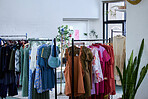 Fashion, retail and clothes in store for shopping choice, decision and option in boutique. Luxury designs, rack and display of clothing, material and textile products for sale, deal and discount