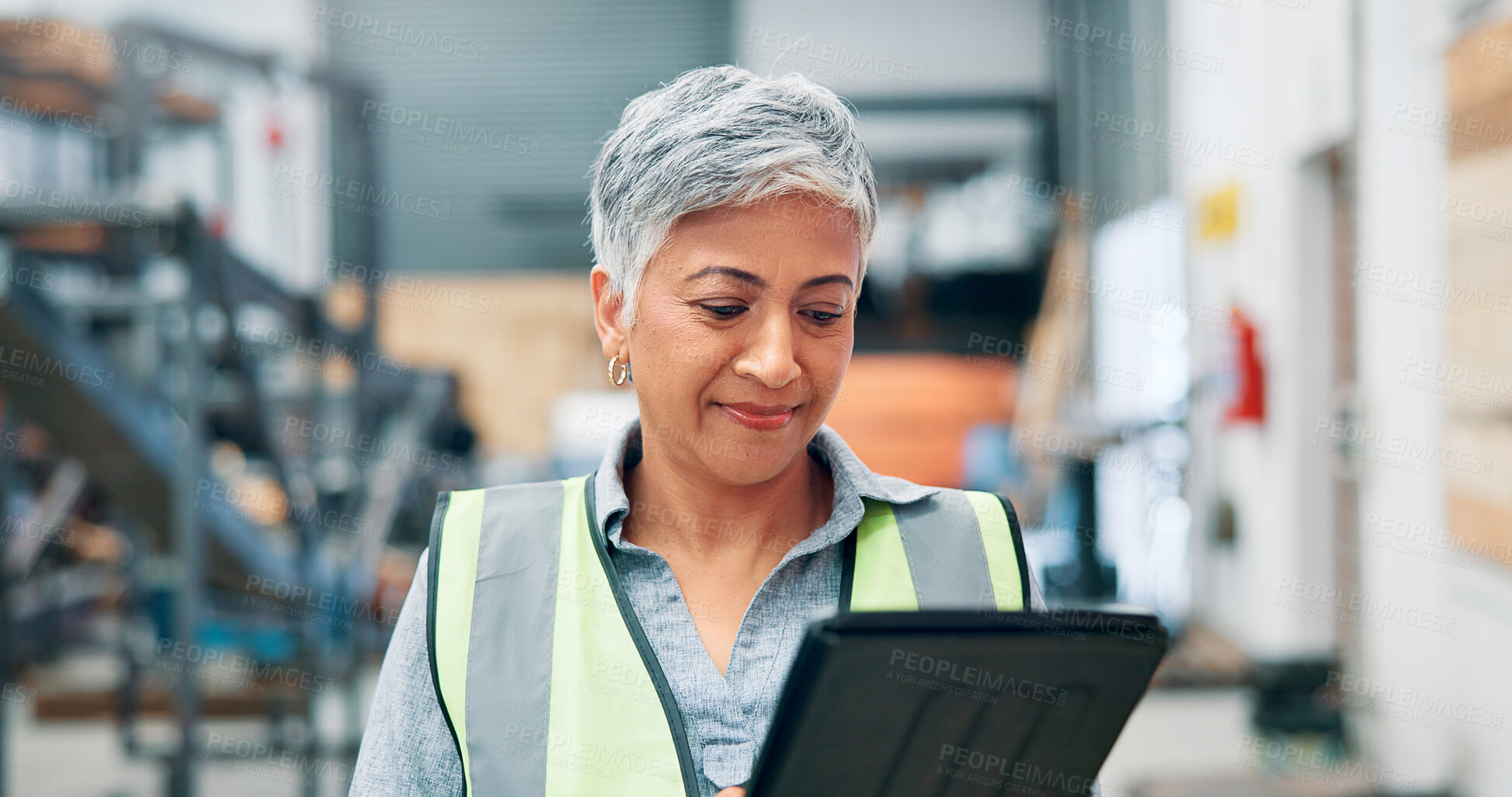 Buy stock photo Woman, engineer and tablet in factory for manufacturing, distribution schedule and task checklist. Mature operator, tech and reading in warehouse for inspection notes, industrial plant and automation