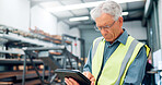 Man, engineer and tablet in factory for manufacturing, distribution schedule and task checklist. Mature operator, tech and reading in warehouse for inspection notes, industrial plant and automation