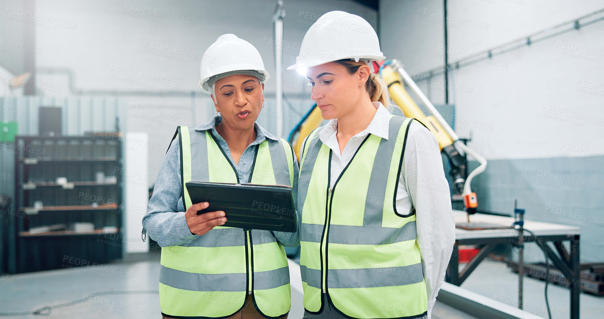 Buy stock photo Women, robotics and teamwork in factory, tablet and conversation with inspection results. Employees, engineering and people in lab, tech and meeting with app, design review or system configuration