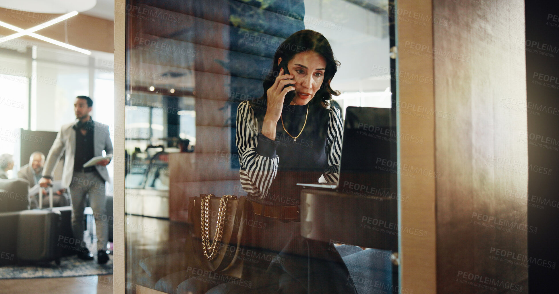 Buy stock photo Laptop, lobby and phone call with business woman in pod at hotel for communication or update. Computer, conversation and hybrid work with mature employee in cubicle for accounting or finance feedback