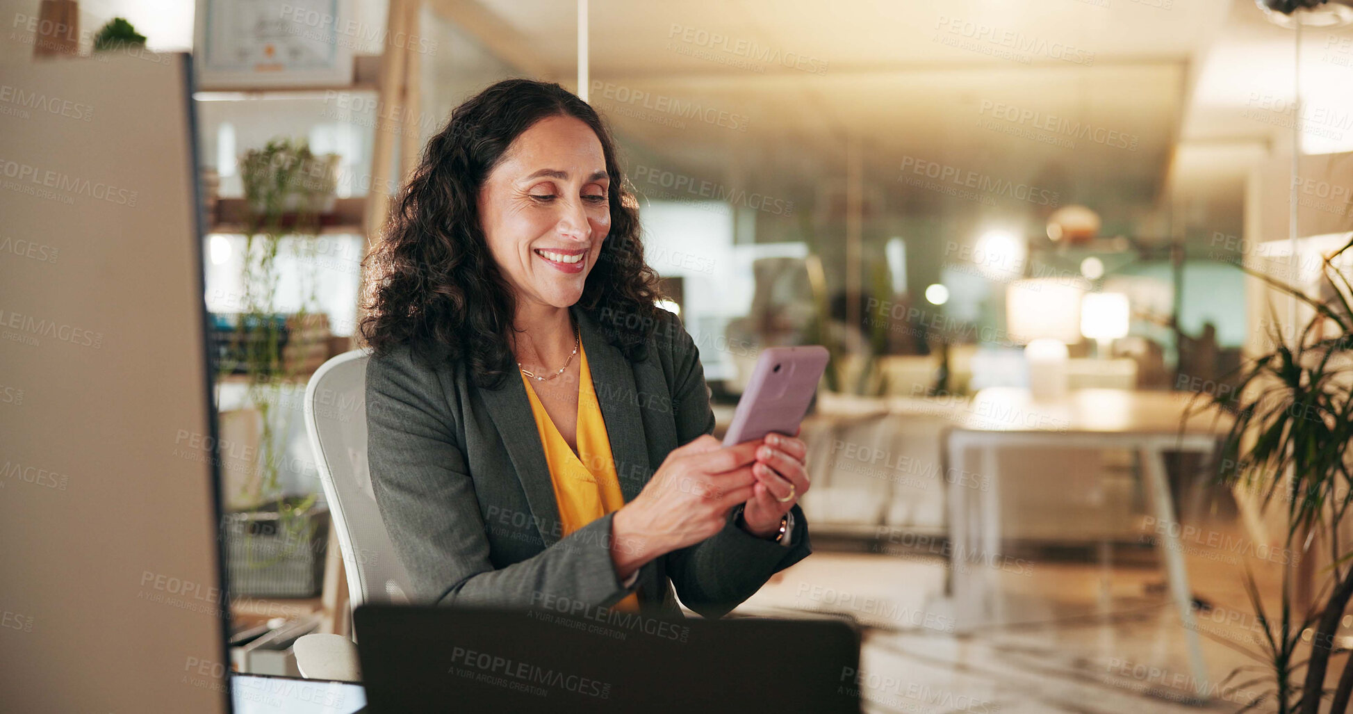 Buy stock photo Night, employee and woman with smartphone, texting and communication with client for financial help. Happy, networking and person with mobile for chat, wealth manager and working late with tech