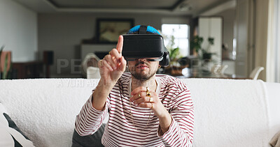 Buy stock photo Gaming, touch and virtual reality with man on sofa in home for interactive or online experience. Click, video game and vr headset with person in apartment for futuristic entertainment or streaming