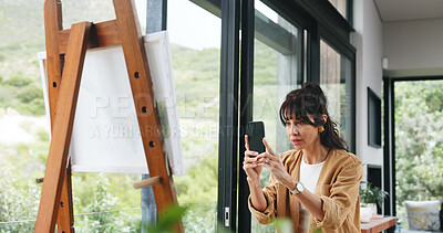 Buy stock photo Painting, phone and picture with woman in workshop for design reference, artist project and contact. Talent inspiration, gallery artwork and canvas with mature person in  studio for photography