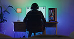 Man, computer screen and gamer with headphones in home, night and mockup space for user experience. Person, pc and monitor with back, streaming and online video game with challenge at apartment