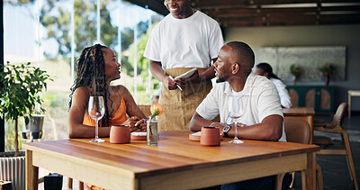 Buy stock photo Black couple, restaurant or waiter with notebook for order, romantic date or fine dining experience. Man, woman and customer service with menu option for food choice, recommendation or suggestion