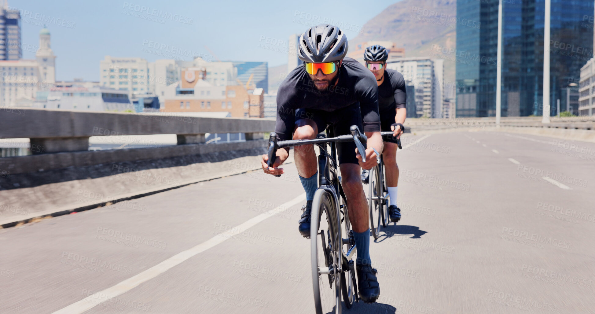 Buy stock photo Men, bicycle and team on bridge in town, speed and helmet for workout with sunglasses in summer. People, cycling and bike on road, triathlon training or fitness with cardio challenge in urban city