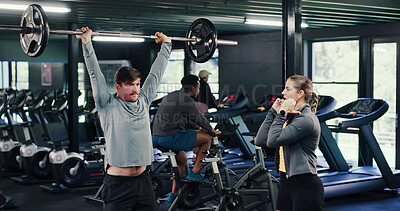 Buy stock photo Weightlifting, personal trainer or man with barbell in gym, strength challenge or coaching for bodybuilding. Strong, fitness instructor or people with exercise for muscle gain, explain form or active