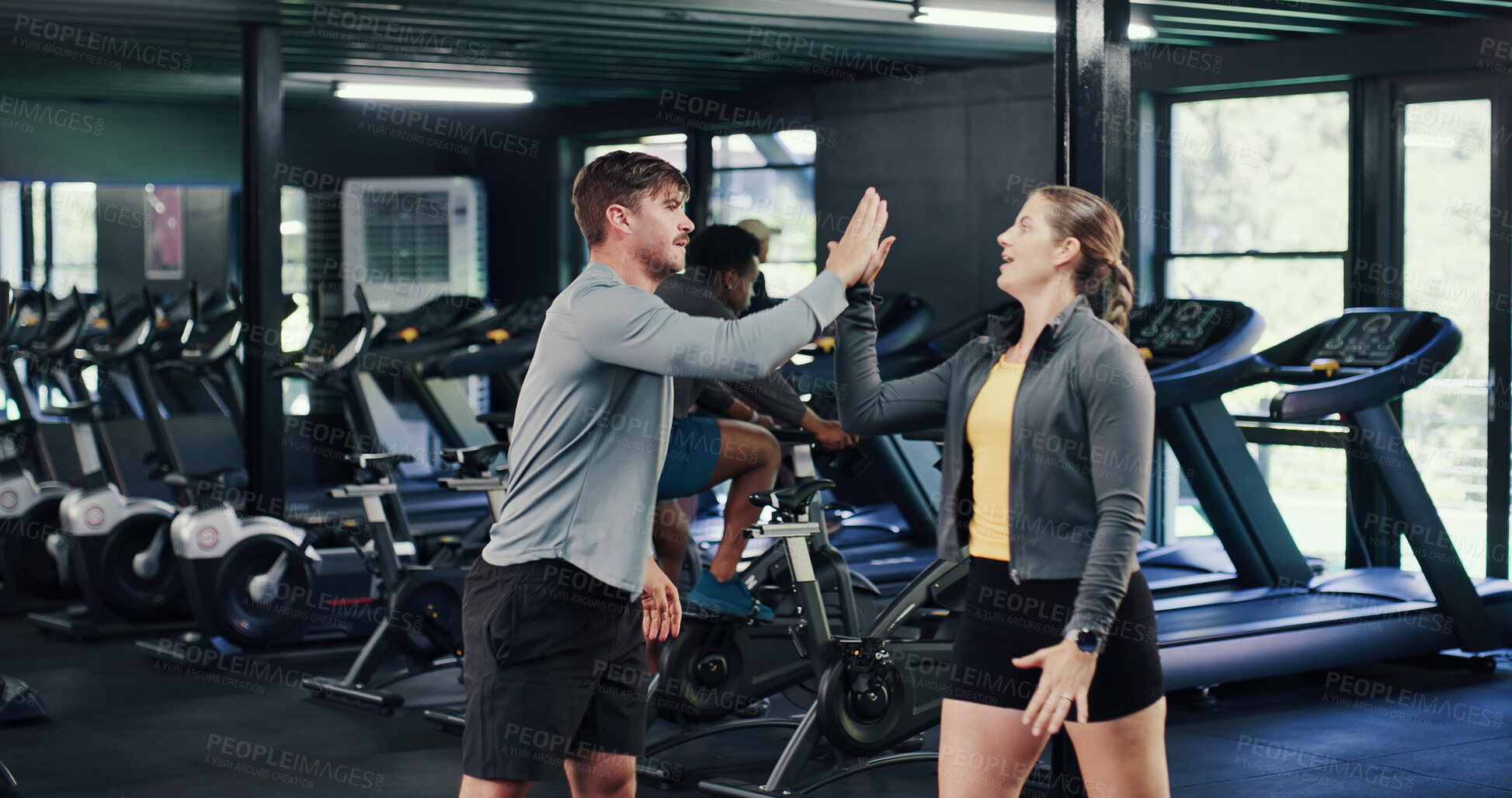 Buy stock photo Fitness, team and high five with people in gym for motivation boost, target or support with coach. Workout club, man and woman with hands together as friends for goal or success with personal trainer