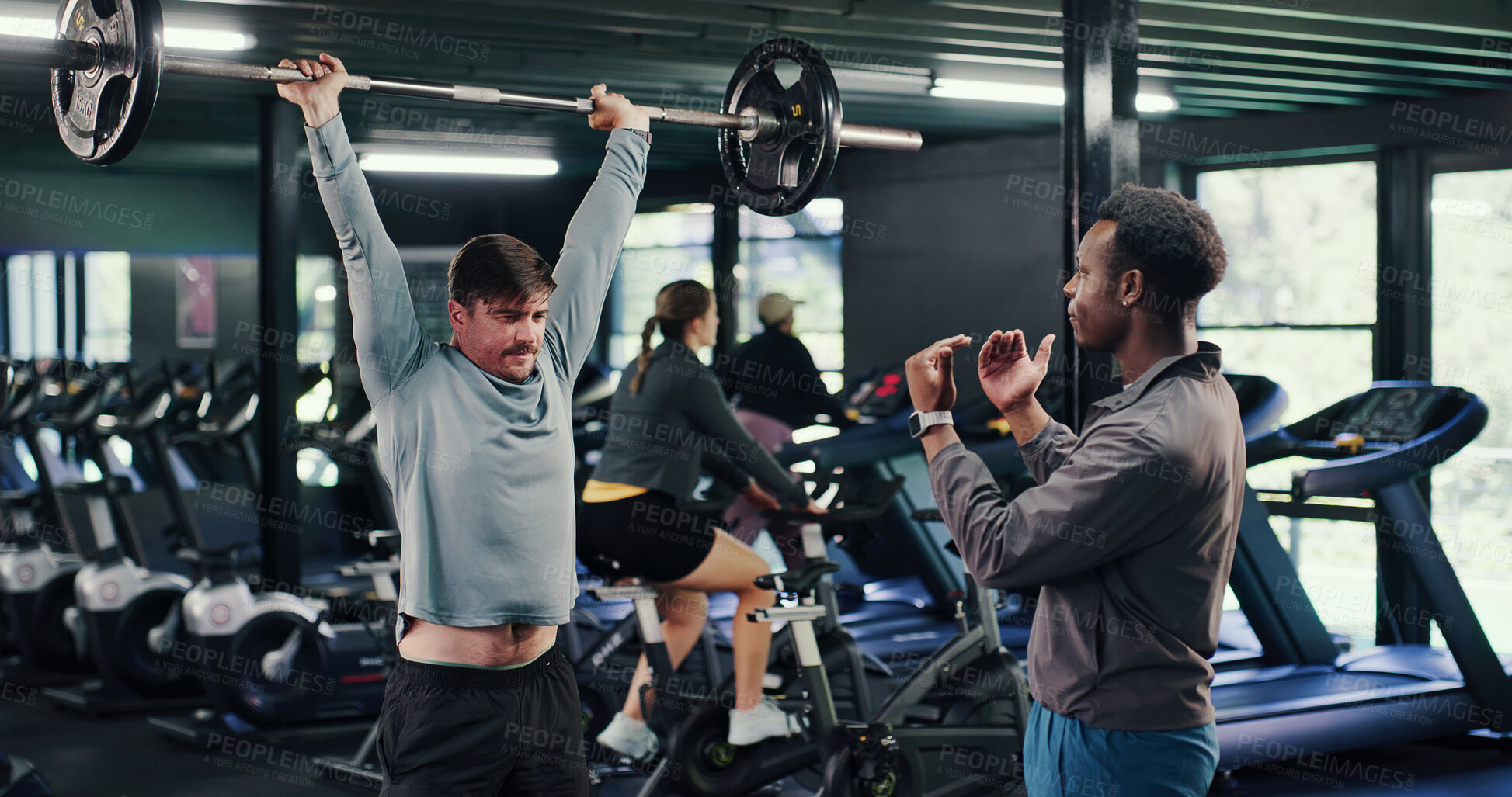 Buy stock photo Fitness, instructor or men in gym with barbell, guidance or help in weightlifting workout. Exercise, advice or personal trainer with equipment, bodybuilding coach or assistance in muscle development.