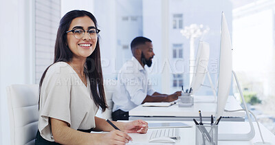 Buy stock photo Computer, portrait and smile with designer woman in workplace for online planning or research. Glasses, pc and writing with happy design professional in coworking office for development or review