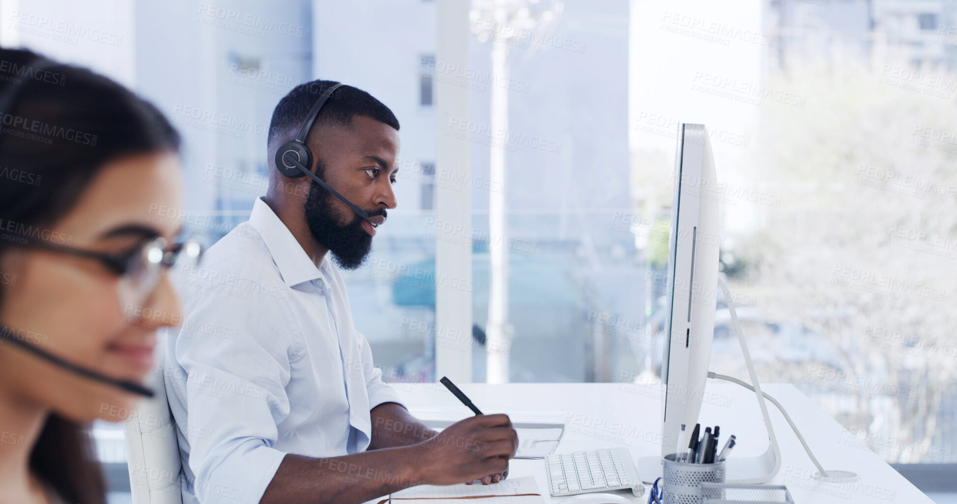 Buy stock photo Call center, headset or man with computer for customer service, help desk contact or troubleshooting advice. Coworking, tech support or virtual assistant with problem solving, writing or hotline