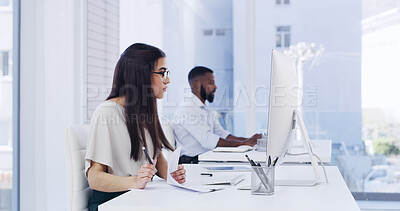 Buy stock photo Woman, document and reading in office with computer, administration and human resources internship. Coworking, female person or intern in workplace with desktop, HR paperwork and check online policy.