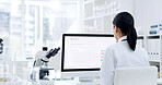 Woman, scientist and reading with computer in lab for research, experiment and medical report. Back, female person and pc screen with schedule, investigation results and information for vaccine study