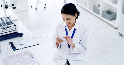 Buy stock photo Happy, scientist and woman with smartphone, lab and communication with contact for medical research. Reading, message and person with mobile for chat, above and smile for test results and science