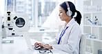 Scientist, laptop and woman with healthcare, typing and medical research for notes in laboratory. Headphones, doctor and report with chemist, test results or development with biotechnology study
