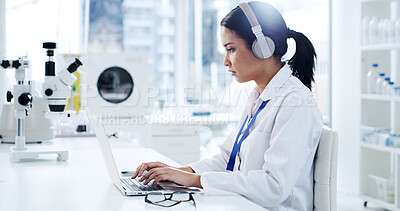 Buy stock photo Scientist, laptop and woman with typing, headphones and healthcare for notes in laboratory. Medical research, doctor and podcast with chemist, test results or development with biotechnology study