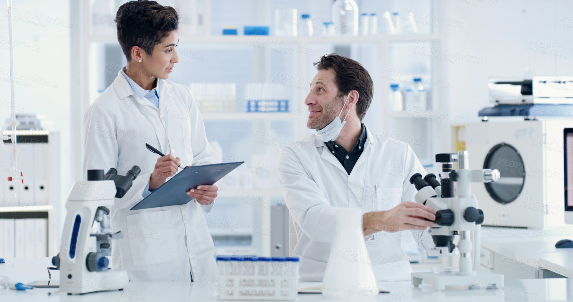 Buy stock photo Woman, scientist and team with clipboard at lab with notes, happy and medical research for virus cure. People, science and man with microscope, checklist and writing report for vaccine development