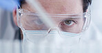Scientist, pipette and man with glasses, drug solution and medical research for chemistry in laboratory. Sample, vial and doctor with dropper, experiment and PPE for synthesis with biotechnology