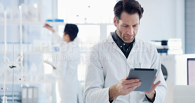 Buy stock photo Scientist, tablet and man with medical research, reading and healthcare notes in laboratory. Thinking, doctor and report with chemist, test results or development for study or experiment planning