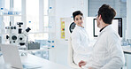 Science, laptop and team with people in laboratory for medical research, vaccine review or planning. Healthcare study, online report and partner with scientists in clinic for biotechnology discussion
