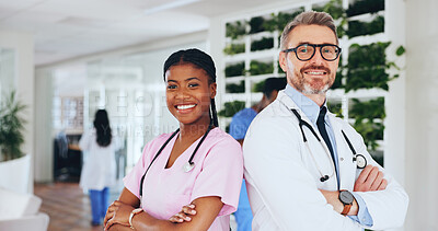 Buy stock photo Doctors, team and happy with arms crossed in clinic for medical service, career pride or about us. People, healthcare staff and hospital portrait with smile for health integrity, trust and confidence