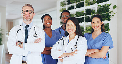 Buy stock photo Medical, team and happy with arms crossed in clinic for health support, career pride and about us. People, doctors and nurses with group portrait in hospital for healthcare integrity, trust and smile