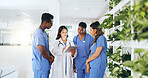 Hospital, meeting and doctor with nurses on tablet for online report, patient results and treatment plan. Healthcare, team and man and women on tech for medical research, surgery schedule or feedback