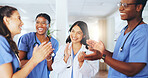 Applause, team and happy with doctors in hospital for good news, healthcare promotion and support. Medical achievement, collaboration and bonus with group of people in clinic for celebration
