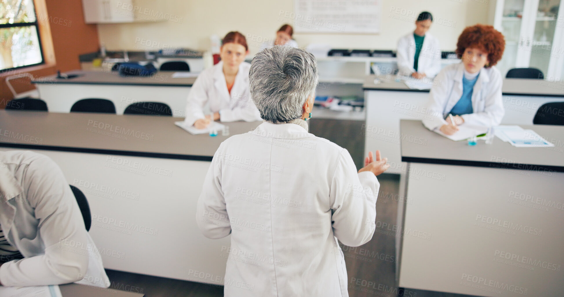 Buy stock photo Teacher, students and communication in classroom for education, science lesson and explain chemistry. Learning, people and teenagers writing notes for physics, knowledge and lab experiment guidance
