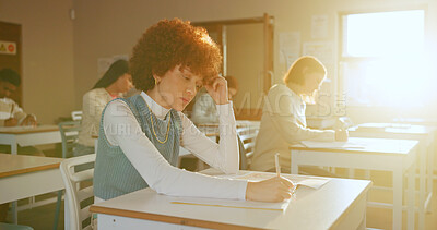 Buy stock photo Bored, tired and girl in high school with writing, learning issue or fatigue in study task. Mental health, flare and teenager in classroom with notes, daydreaming and burnout for academic work.