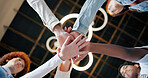 Group, meeting and unity with hands together below for collaboration, inclusion or mission. Low angle, people or creative community with pile or stack in solidarity, huddle or circle for teamwork