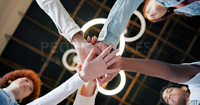 Buy stock photo Group, meeting and unity with hands together below for collaboration, inclusion or mission. Low angle, people or creative community with pile or stack in solidarity, huddle or circle for teamwork