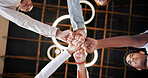 People, meeting and unity with fist bump below for collaboration, inclusion or mission together. Low angle, group or creative community in huddle, circle or trust for teamwork, solidarity or support