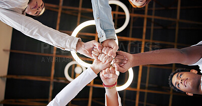 Buy stock photo People, meeting and unity with fist bump below for collaboration, inclusion or mission together. Low angle, group or creative community in huddle, circle or trust for teamwork, solidarity or support