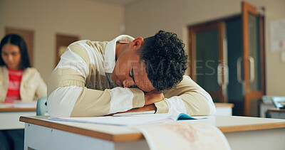 Buy stock photo Sleeping, education and student in classroom with test, exam or assignment with fatigue or burnout. Tired, learning and boy teenager in lesson with exhaustion for studying with quiz at school.